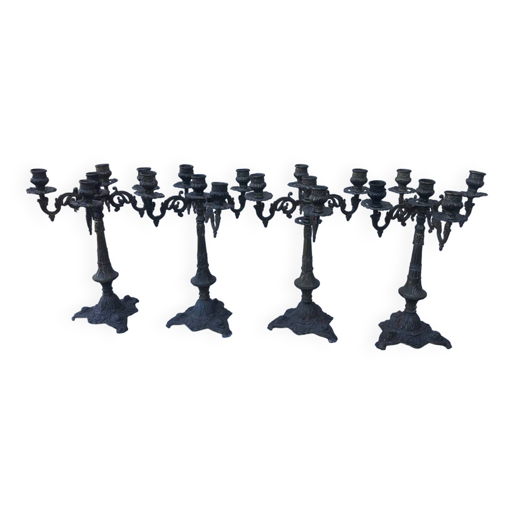 4 identical old brass candlesticks