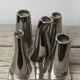 Asymmetrical multitube vase on a base, in silvered ceramic, 1970.