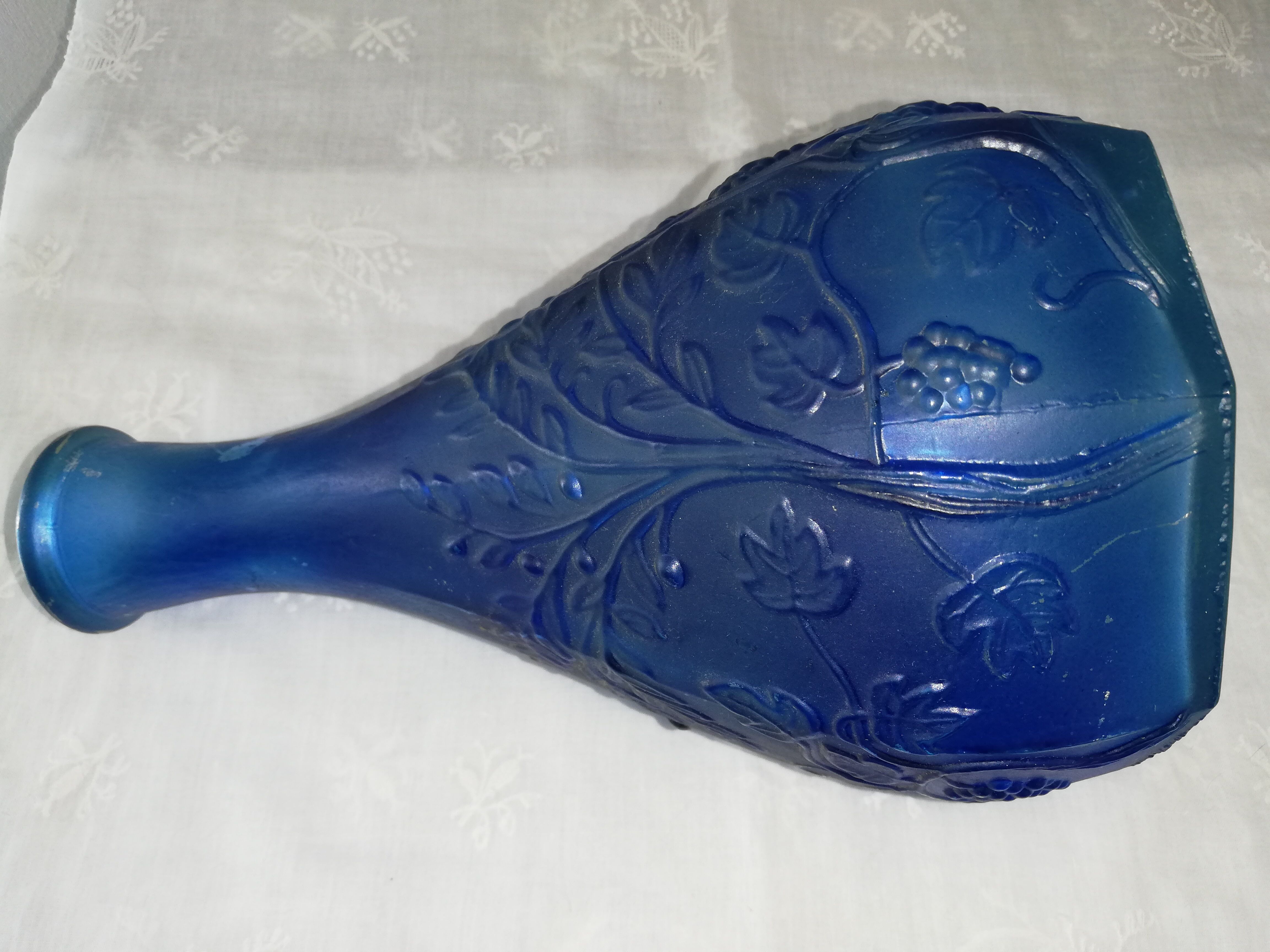 Blue glass bottle, engraved molded