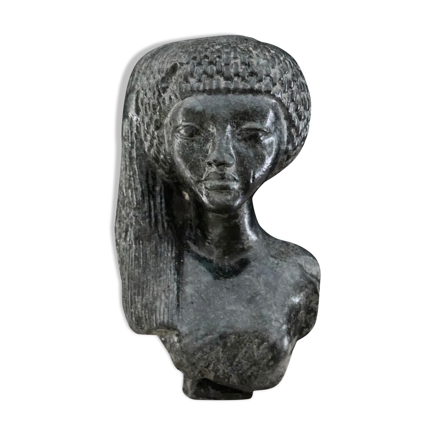 Woman bust in carved stone, 50s
