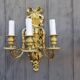 Pair of antique bronze wall sconces from the Napoleonic III era in the Louis XVI style.