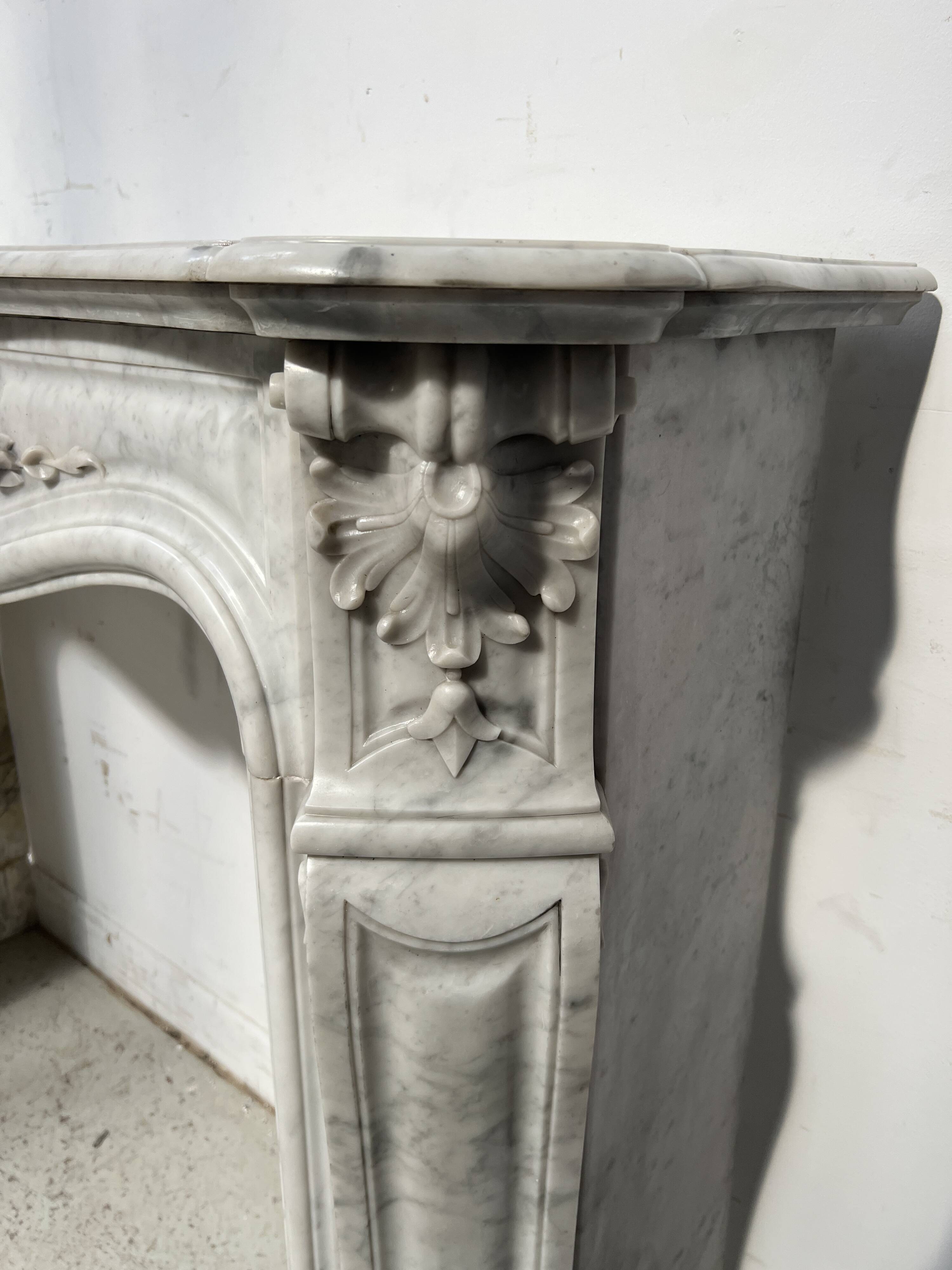 Louis XV style white Carrara marble fireplace, 19th century.