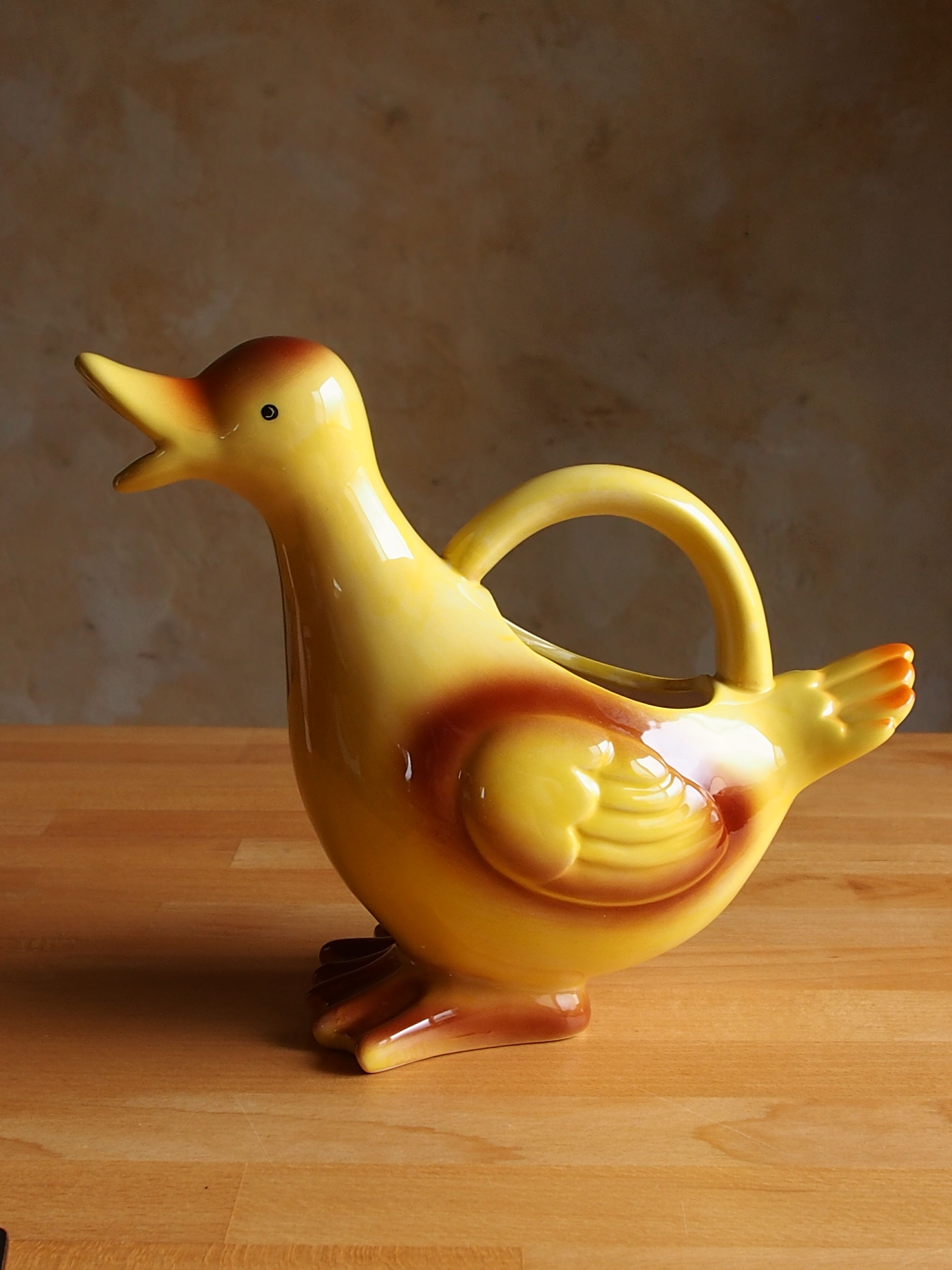 Ceramic watering can in white earthenware, yellow enamel and bird shape