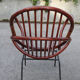 Rattan shell armchair with metal feet
