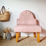 Single bar stool in pink stitched faux leather.