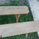 Pairs of large benches in raw fir wood.