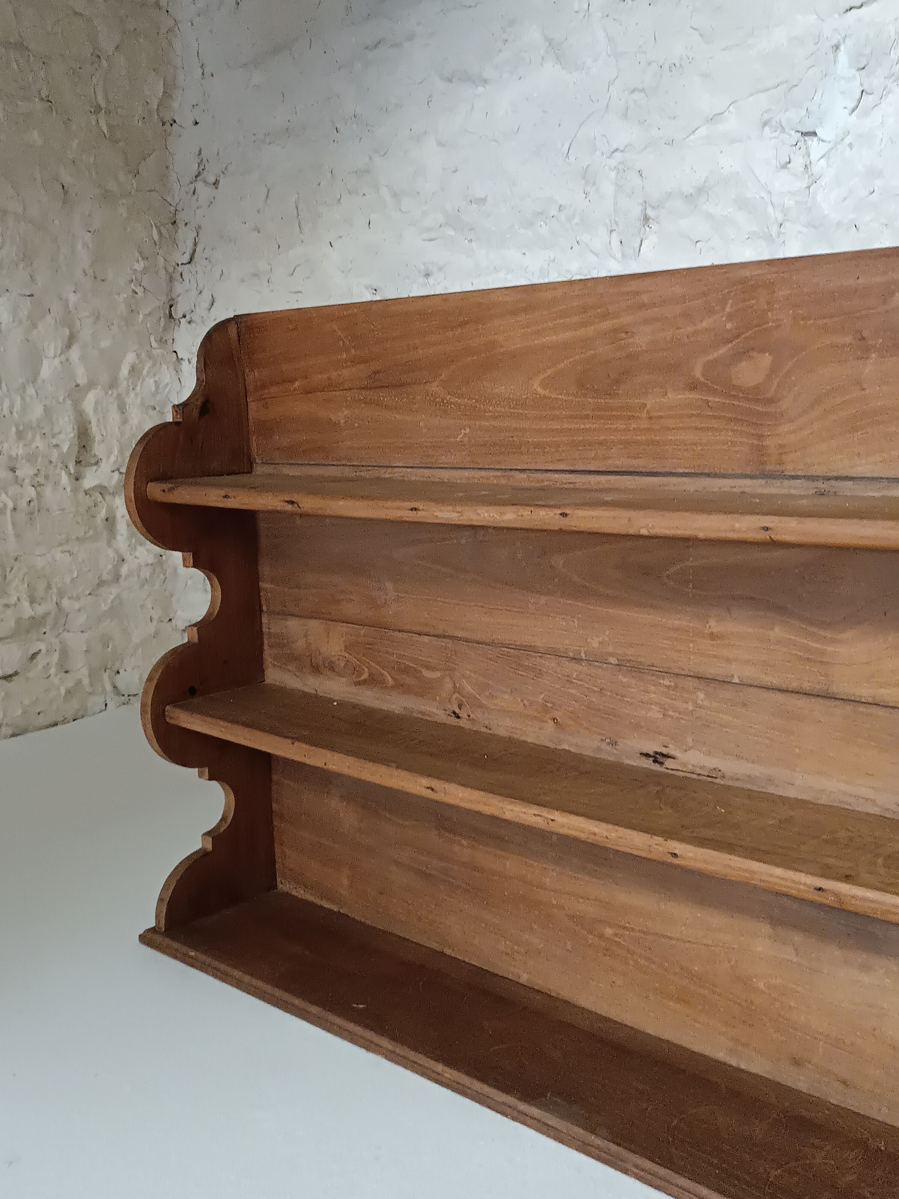 Old wall shelf in raw wood