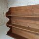 Old wall shelf in raw wood