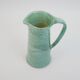 Large green ceramic pitcher with leopard enamel
