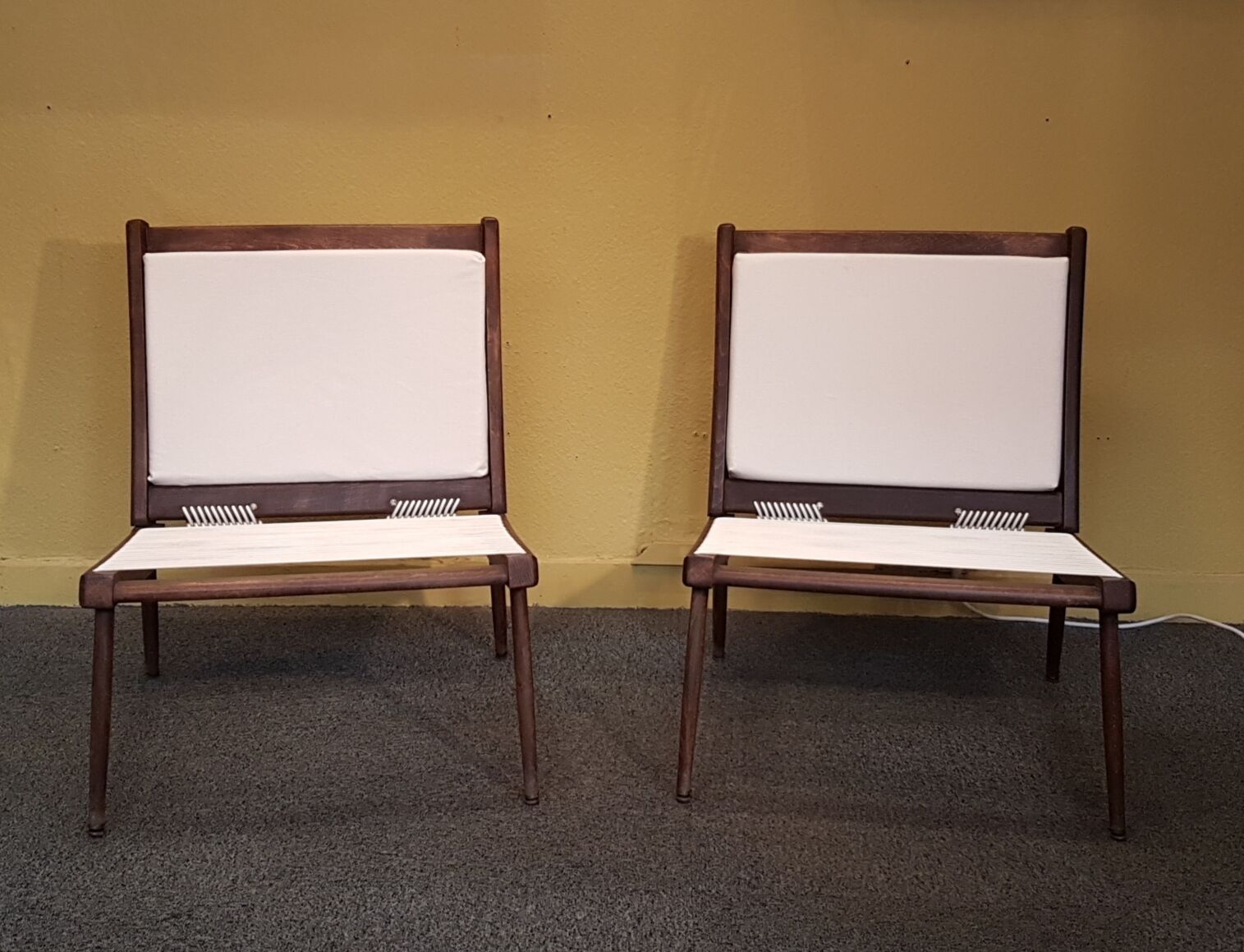 Triumph low armchairs by George Tigien for the European House