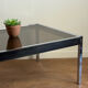 Grande table basse design années 70 chrome, verre fumé et skaï