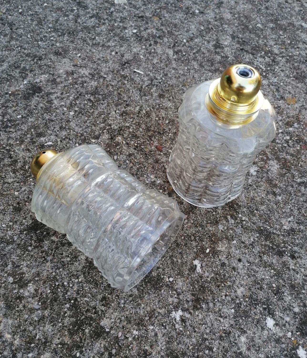 Duo of vintage molded glass globe pendant lights.
