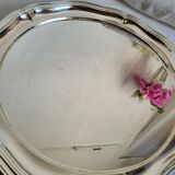 Round silver-plated serving dish with a glass base.
