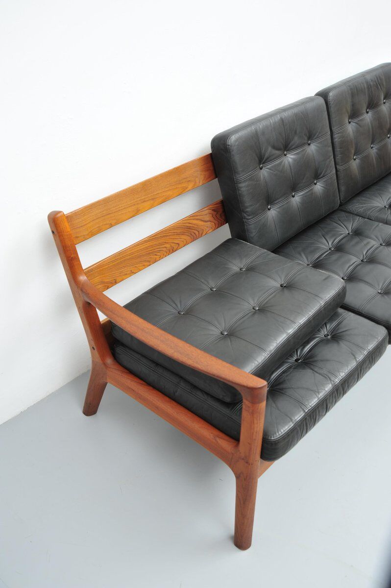 Senator sofa with black leather cushions by Ole Wascher for France and Son