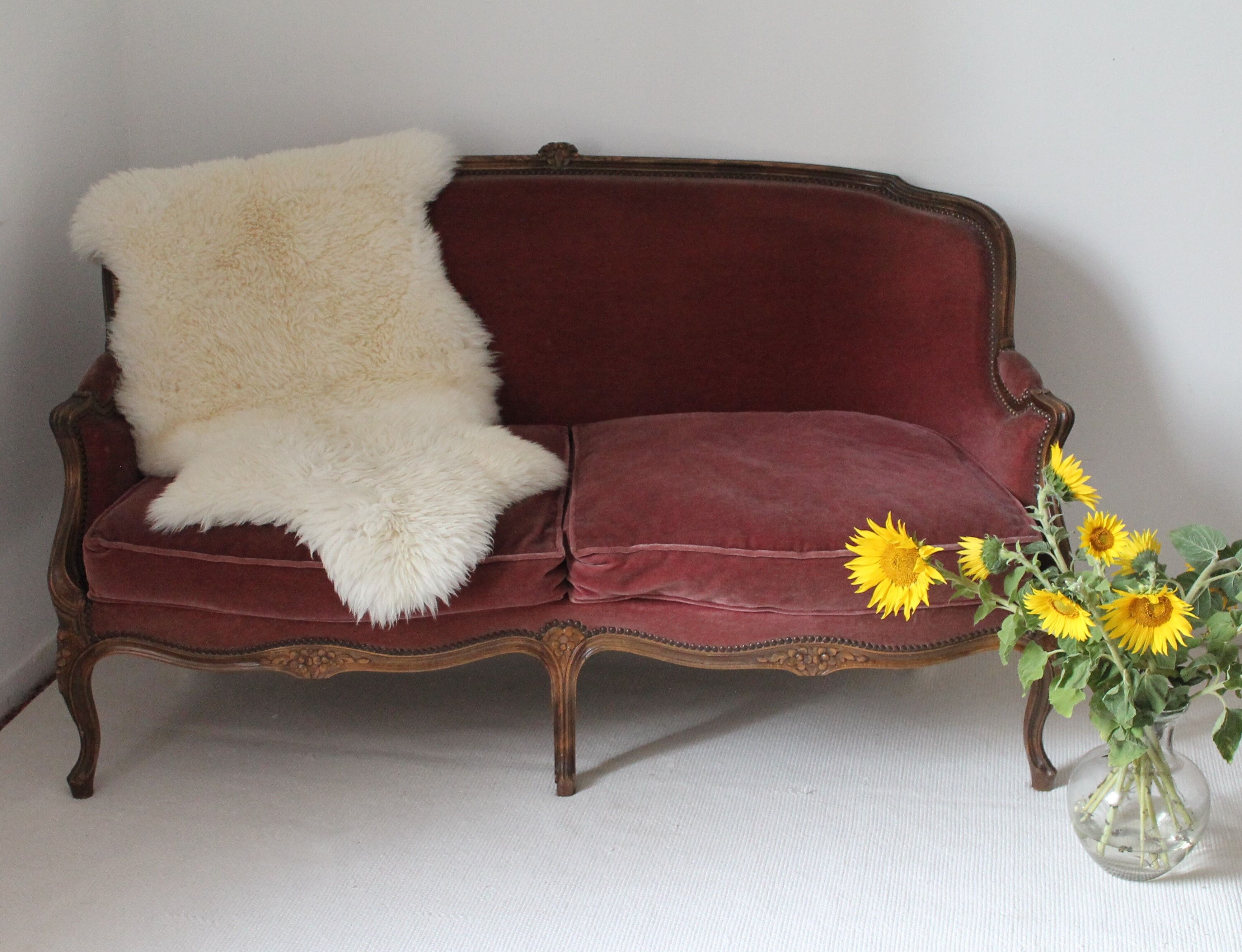 Faded pink velvet sofa
