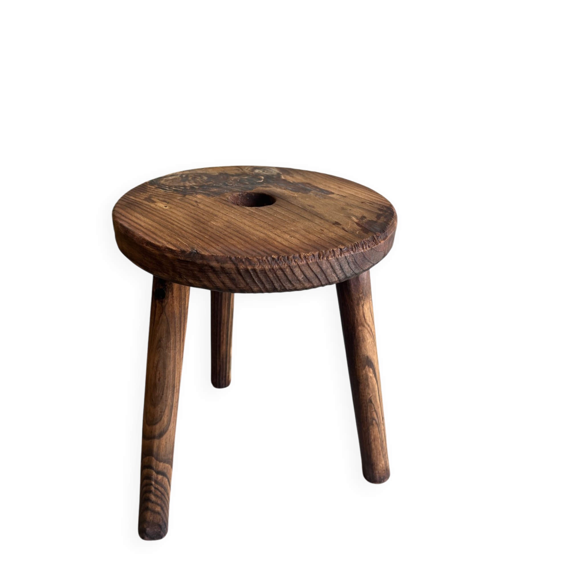 Three-legged wooden stool