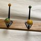 Coat rack with 5 double metal hooks and vintage wooden balls from the 1950s.