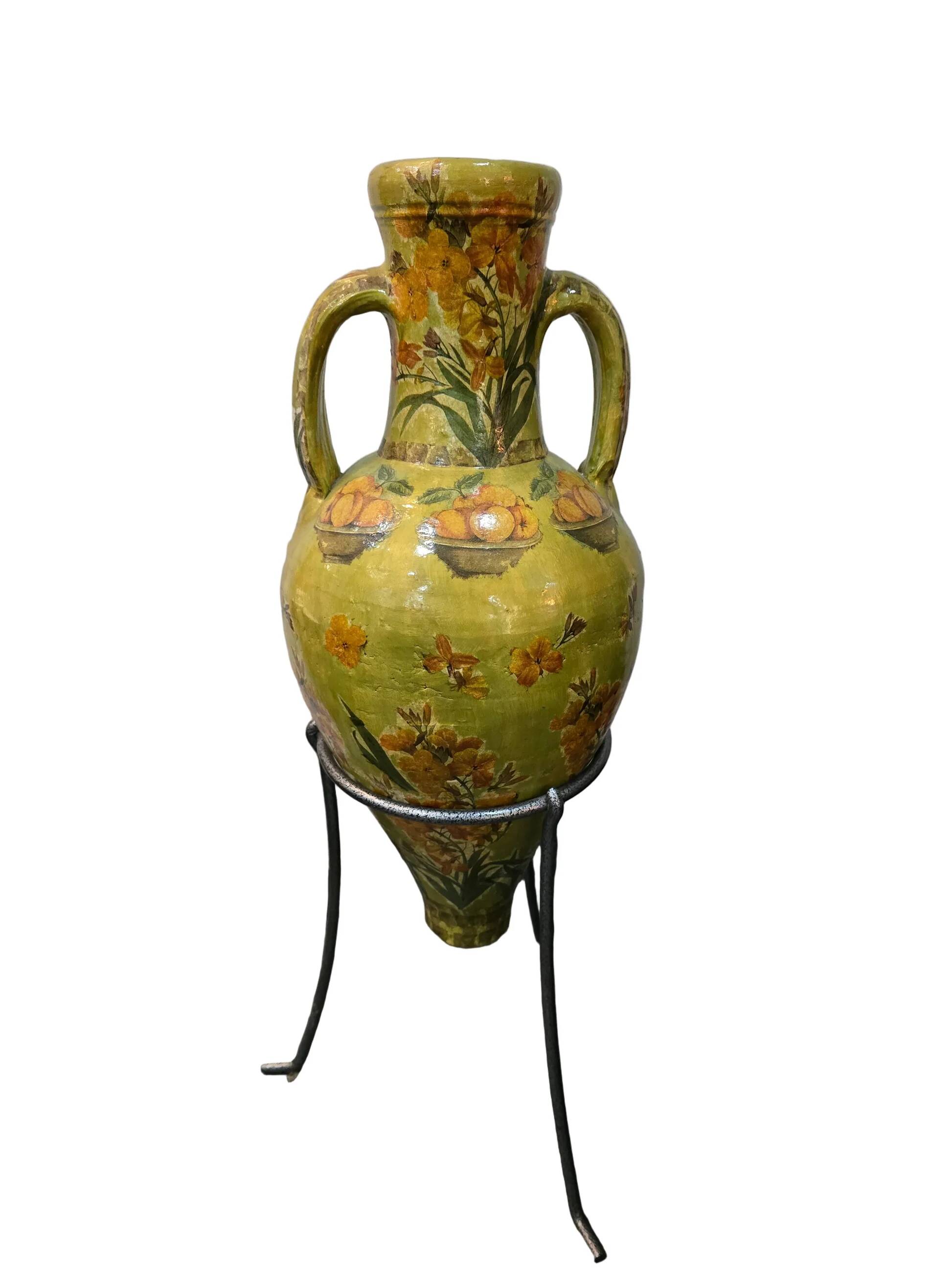 Large decorative vase with handles – painted floral design – on a metal stand