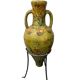 Large decorative vase with handles – painted floral design – on a metal stand