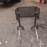 Shield fire with cast iron andirons