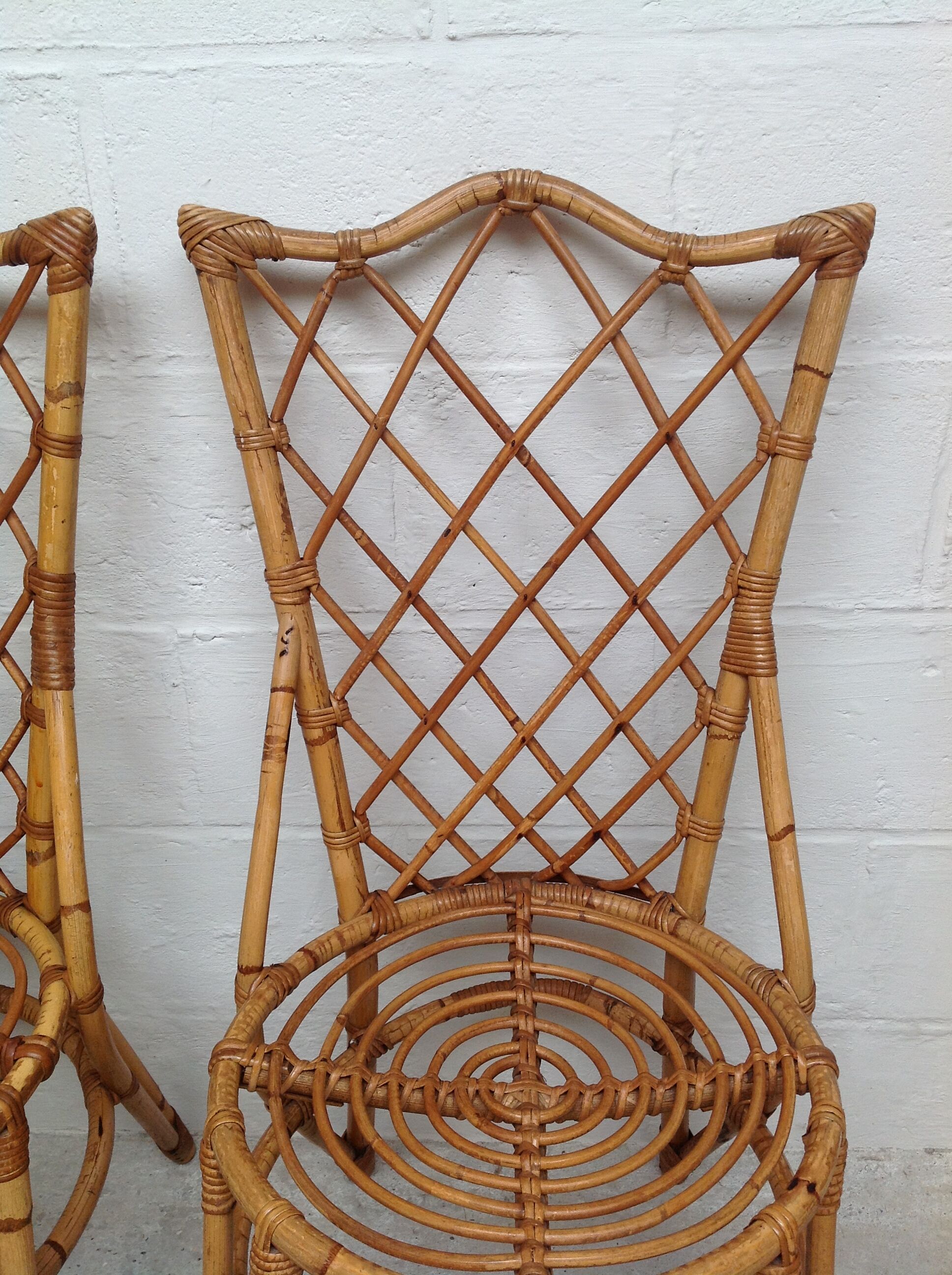 Pair of rattan chairs by Louis Sognot