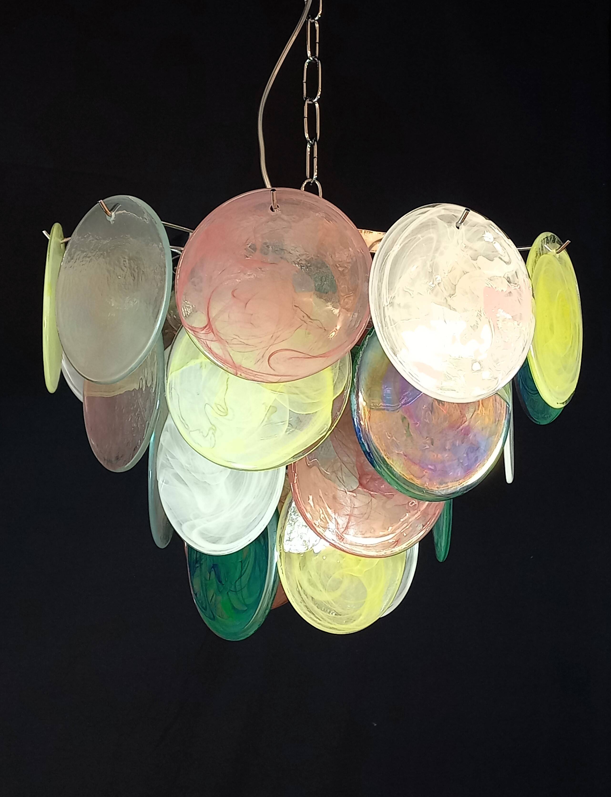 Handcrafted chandelier with Murano glass discs.