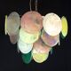 Handcrafted chandelier with Murano glass discs.
