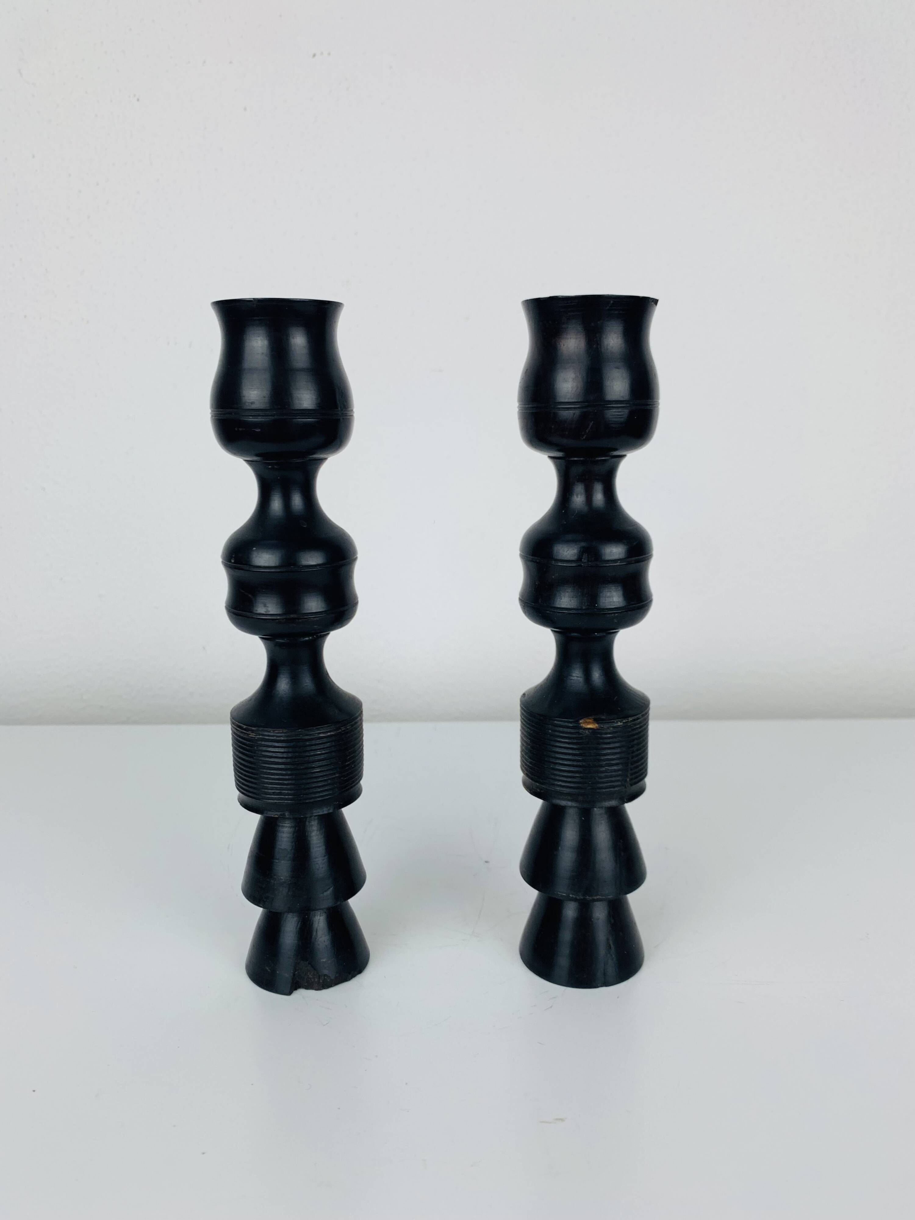 Pair of vintage ethnic blackened wood candlesticks