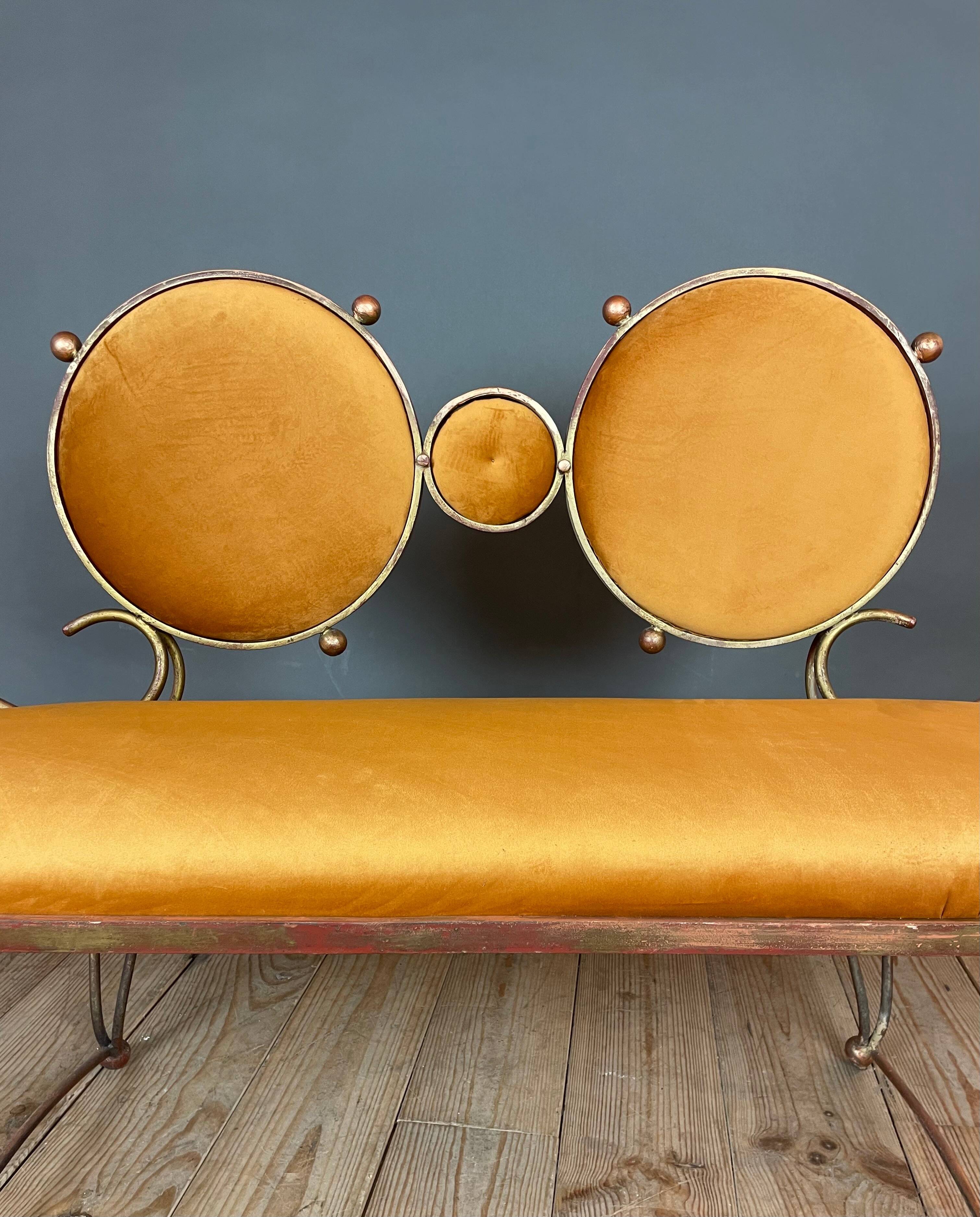 Wrought iron and velvet sofa