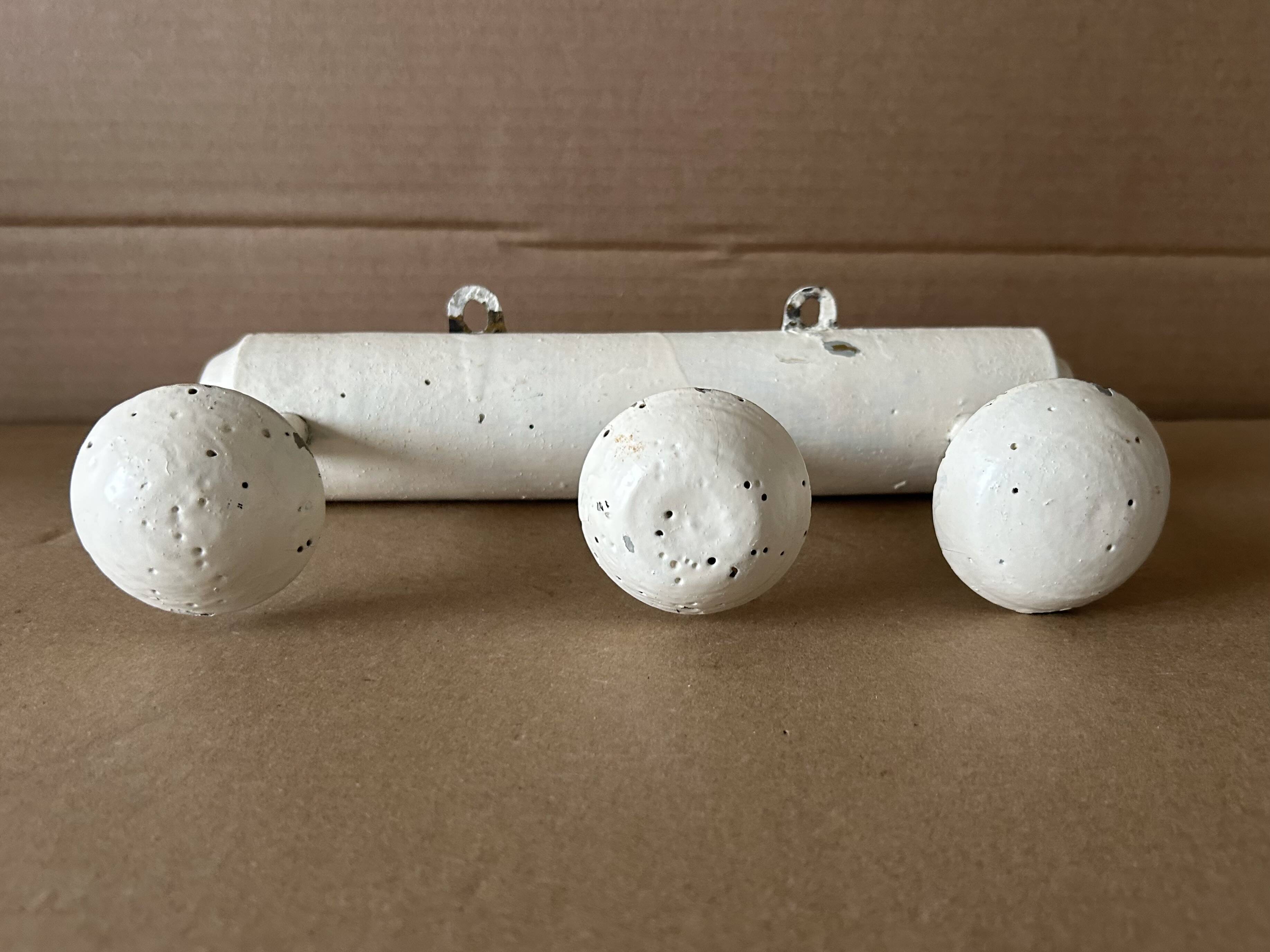 Antique wooden wall-mounted coat rack