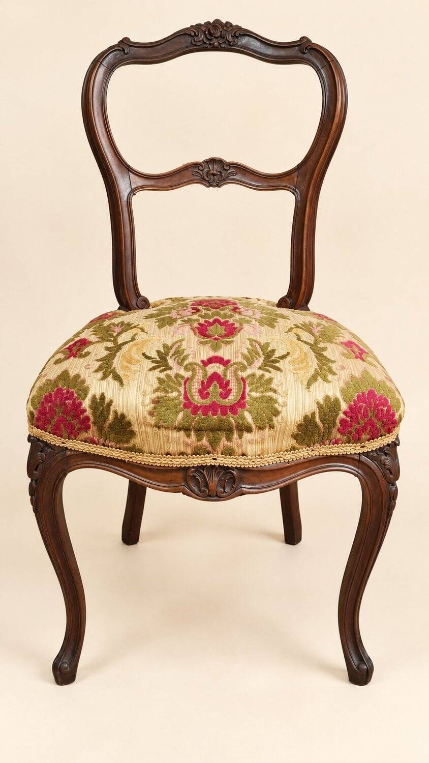 Carved walnut Napoleon III style velvet medallion chair