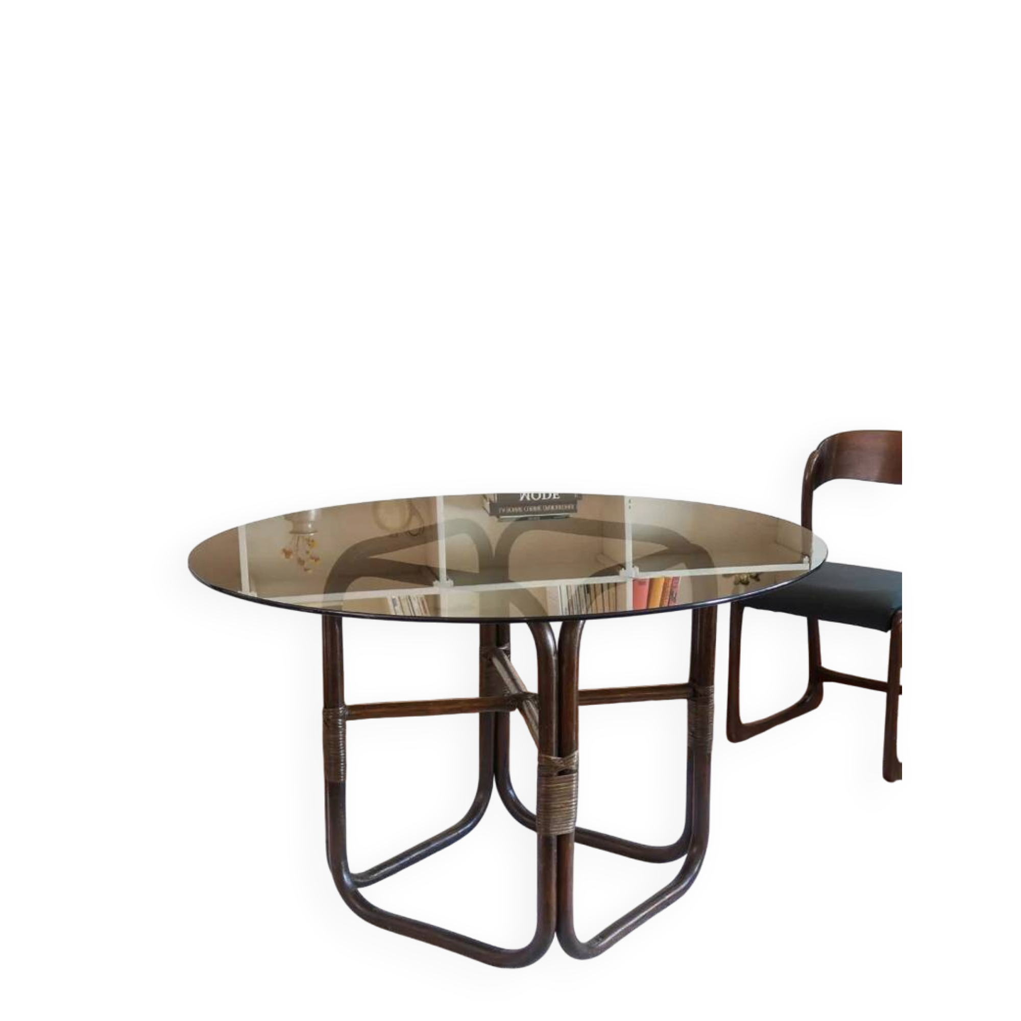 Round dining table in rattan, smoked glass top, 1970s.