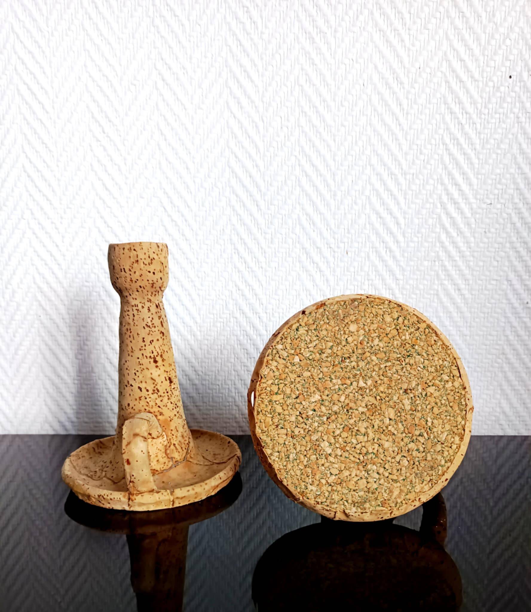 Pair of cork and terracotta candlesticks.