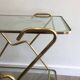 Italian designer rolling table in brass and engraved glass