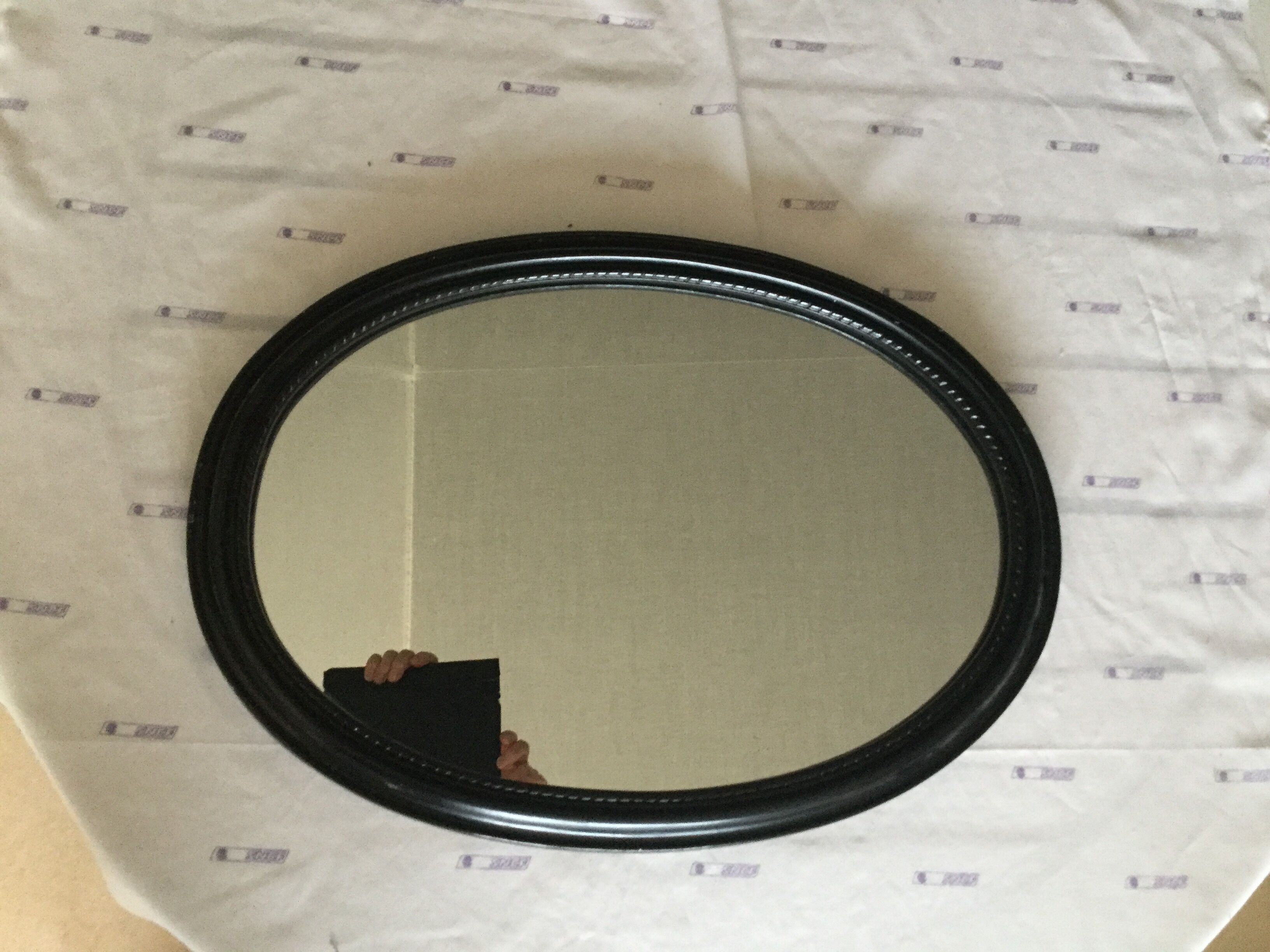 Black laqué wood oval mirror - 53x39cm