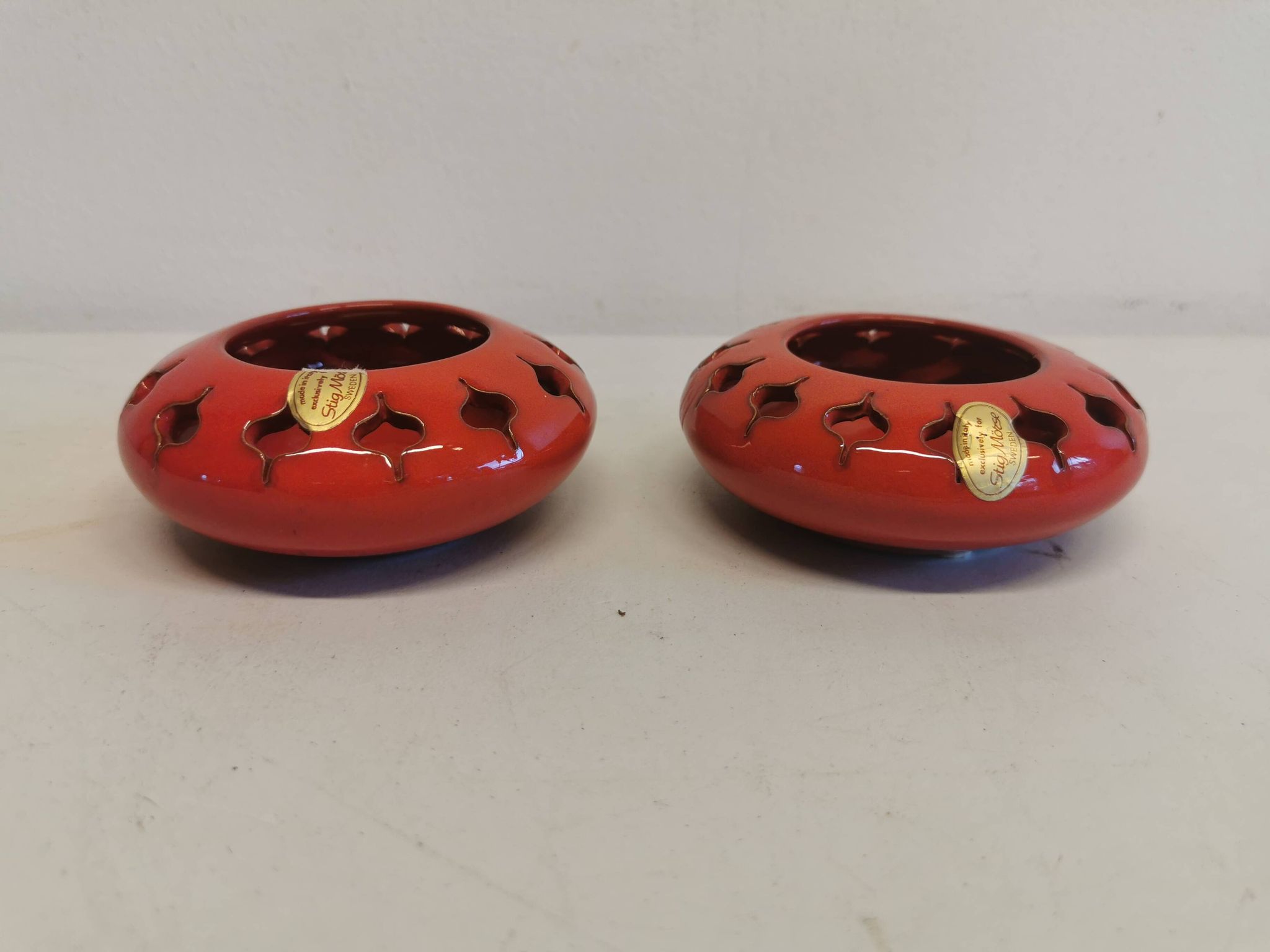 Pair of candle holders from the 1960s-1970s, crafted in red ceramic