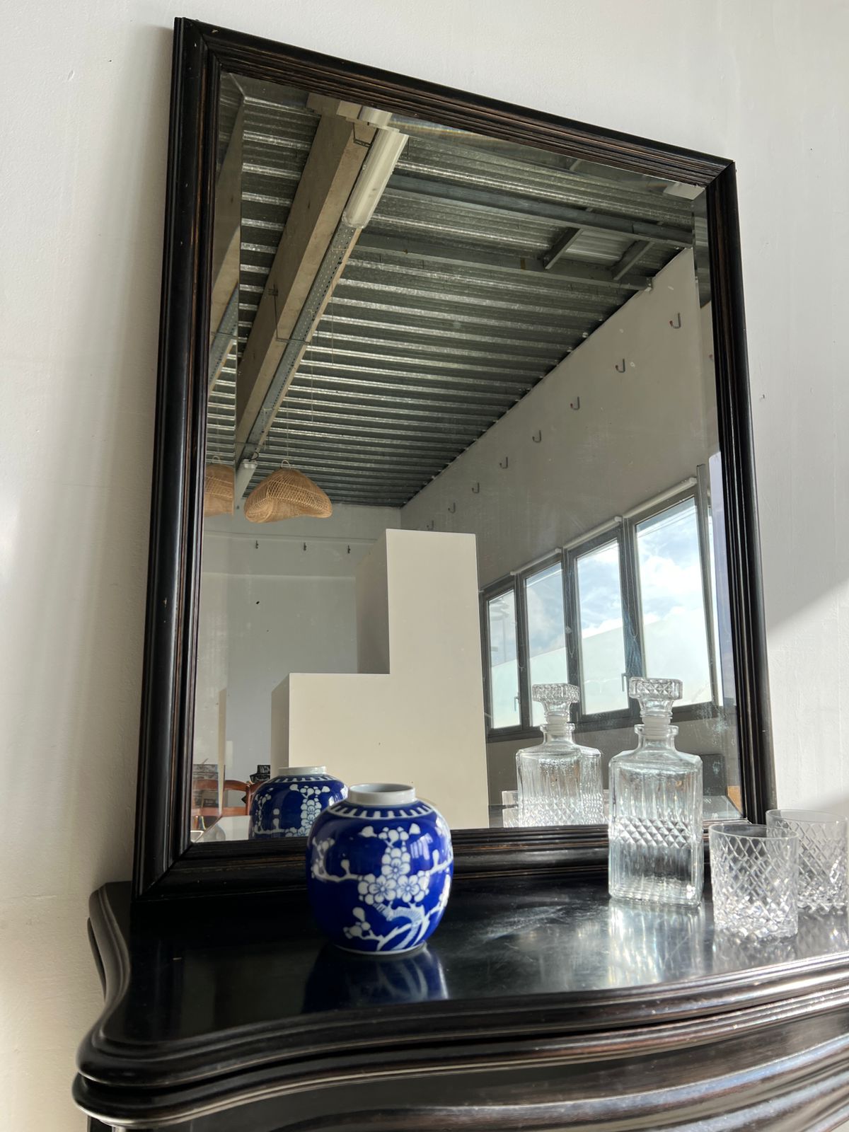 Rectangular mirror in molded blackened wood, beveled glass