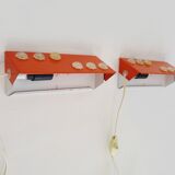 Pair of Scandinavian wall sconces with swivel shade in orange metal. 70