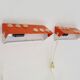 Pair of Scandinavian wall sconces with swivel shade in orange metal. 70