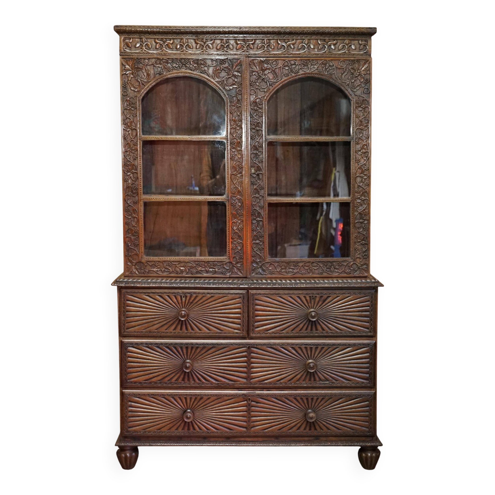 19th-century Anglo-Indian colonial hardwood library on a chest of drawers.