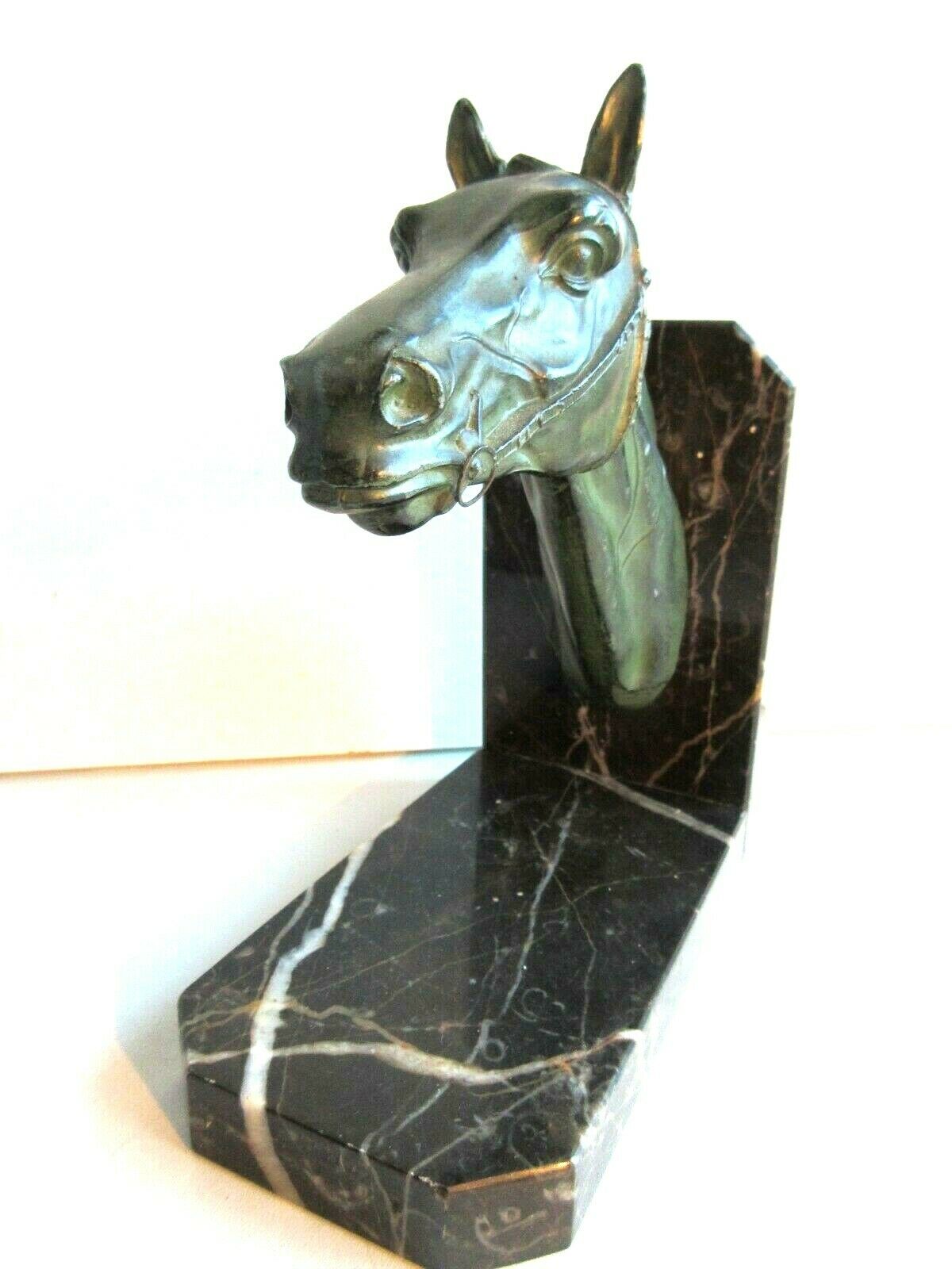 Art-Deco bookend Horse in patinated regulation on black marble support