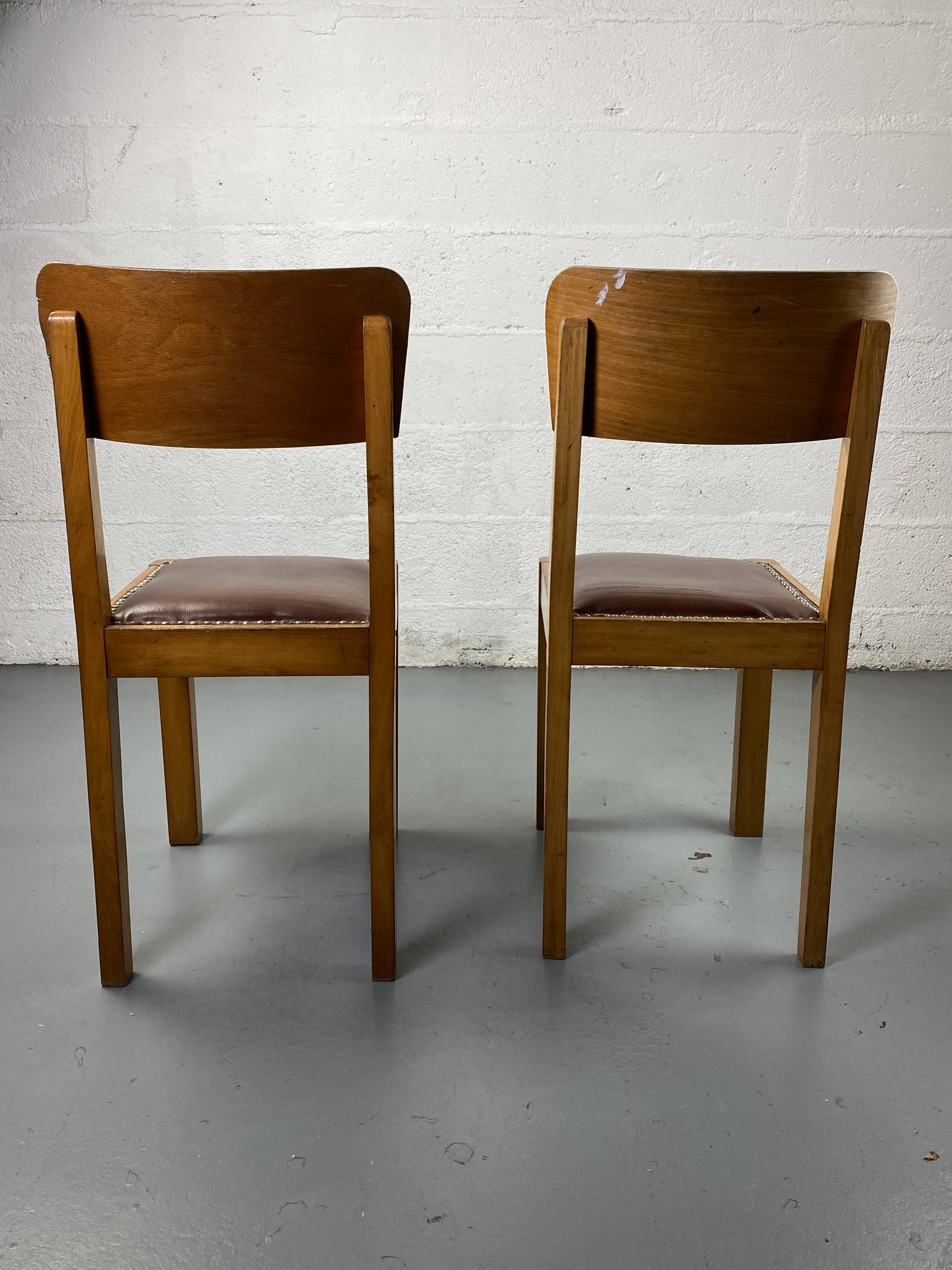 Pair of wooden and leather chairs