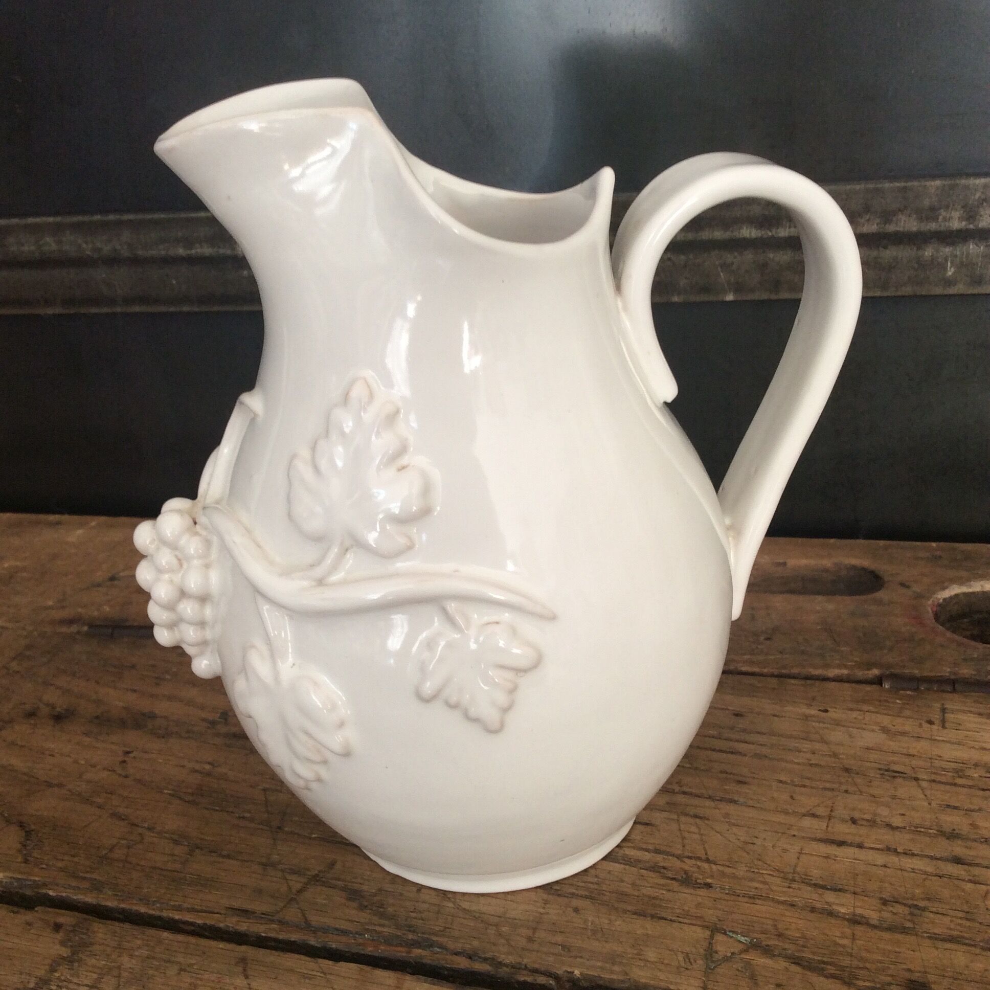 White enamelled ceramic pitcher signed emile tessier malicorne grape bunch