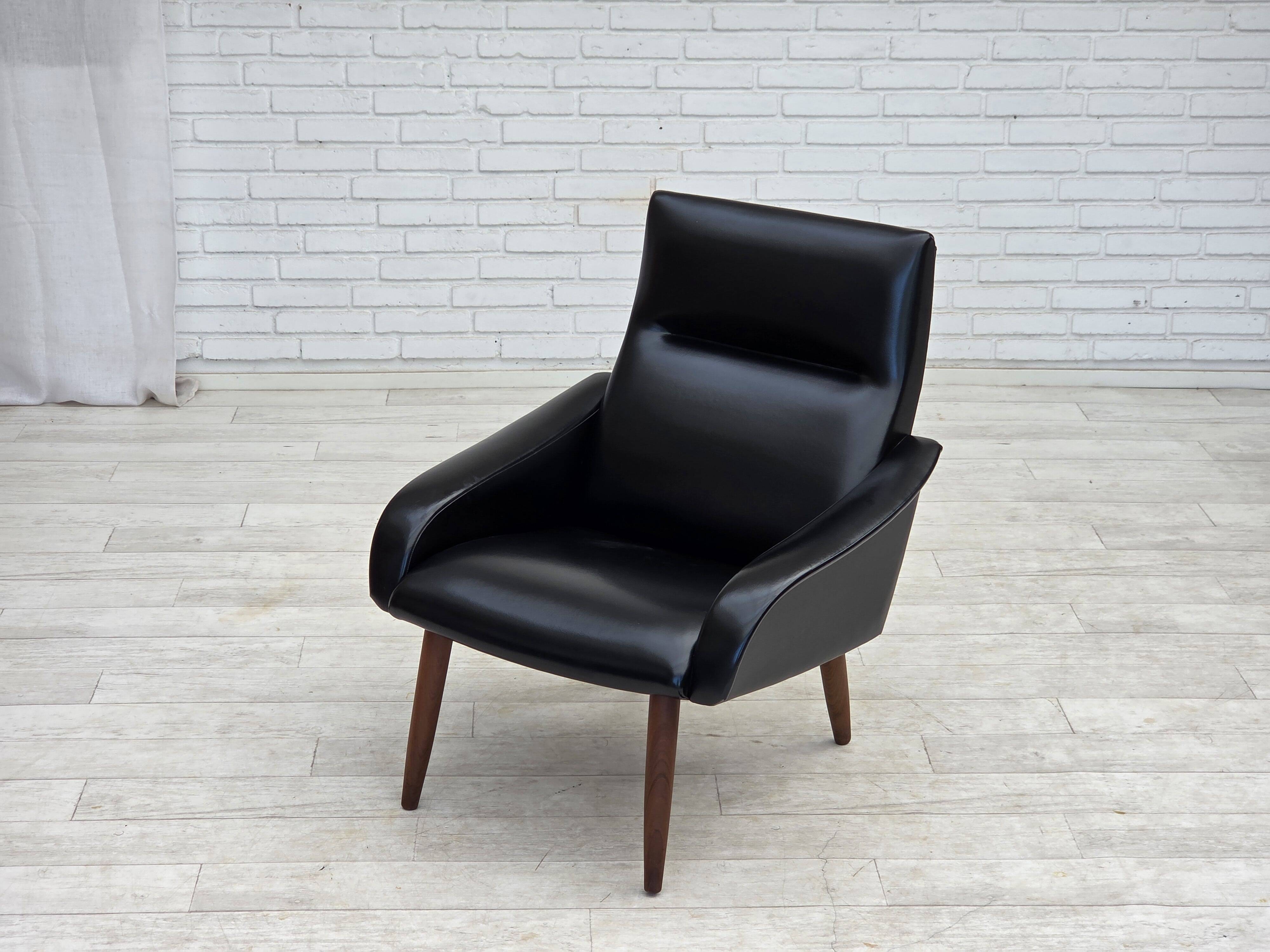 1970s, Danish armchair, black artificial leather, teak wood legs.