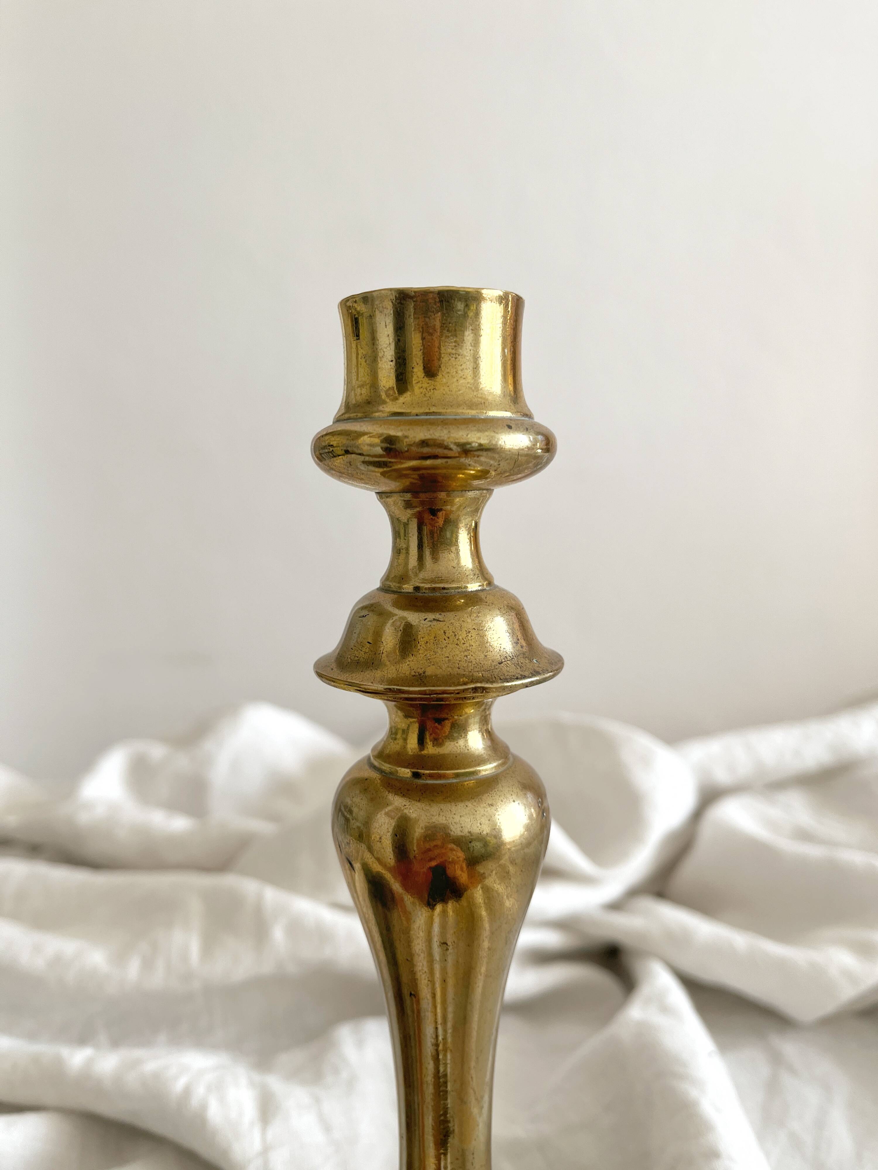 Antique brass candlestick in vintage baluster shape