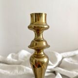 Antique brass candlestick in vintage baluster shape