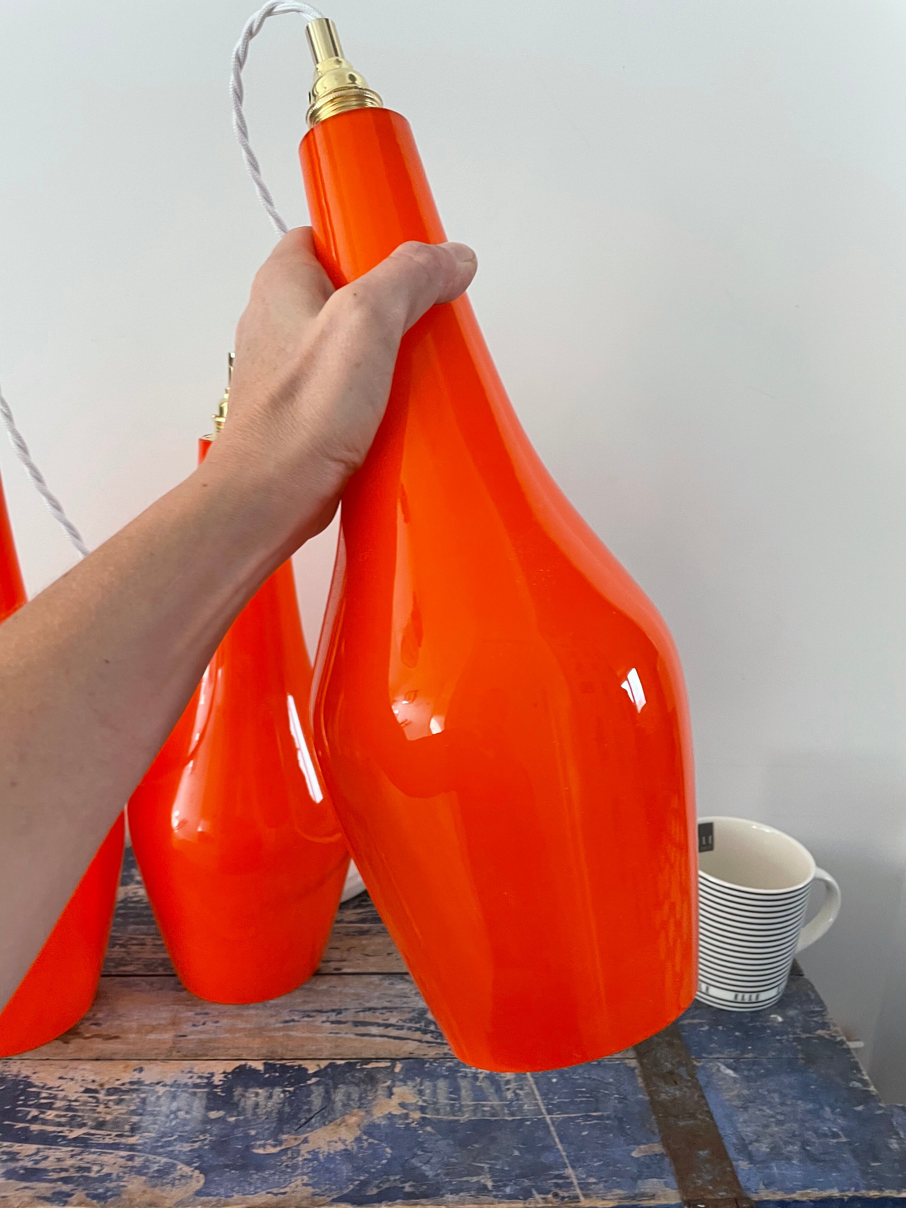Set of three new electrified orange vintage pendant lamps