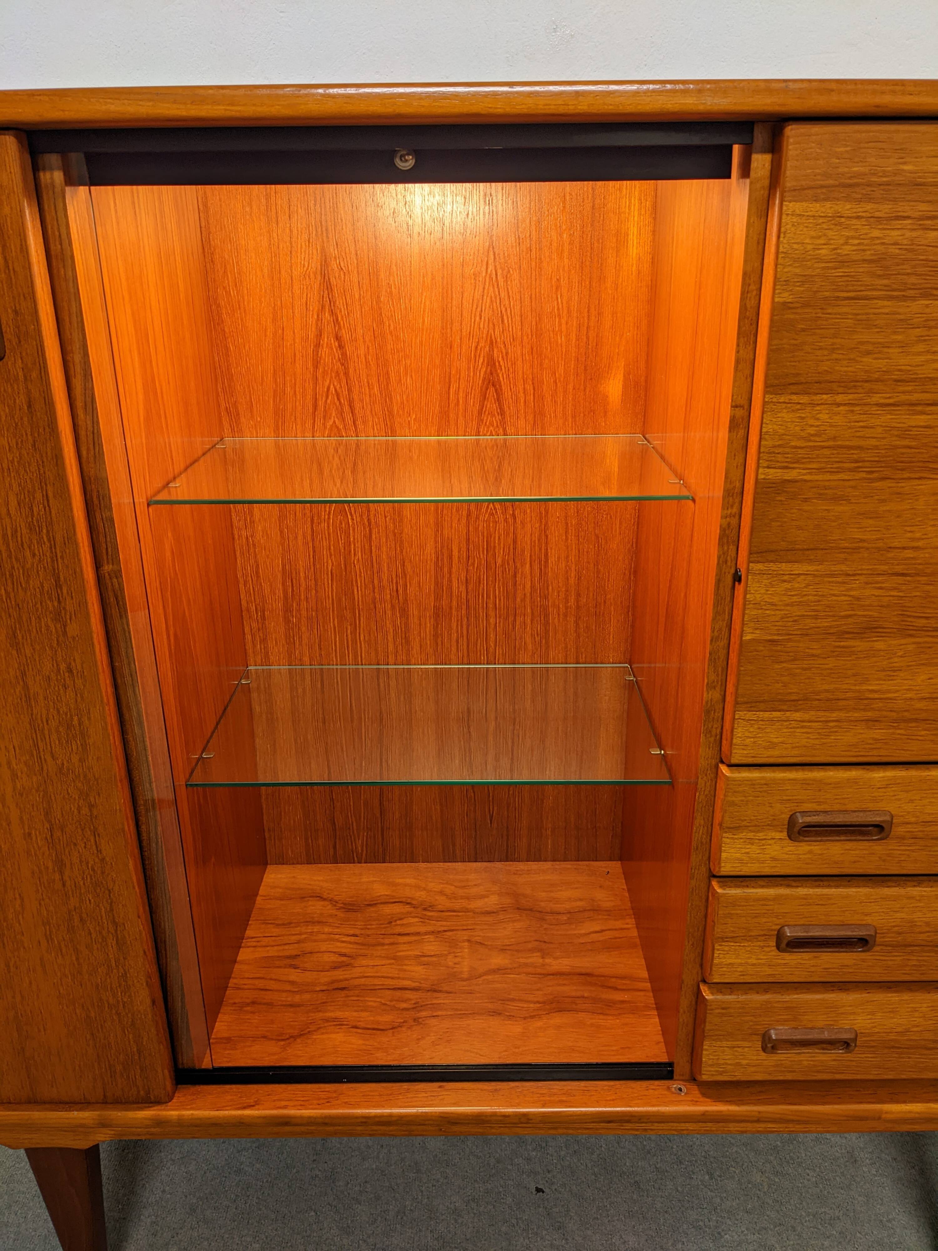 High sideboard, display cabinet and secretary, Scandinavian in teak, France around 1960.