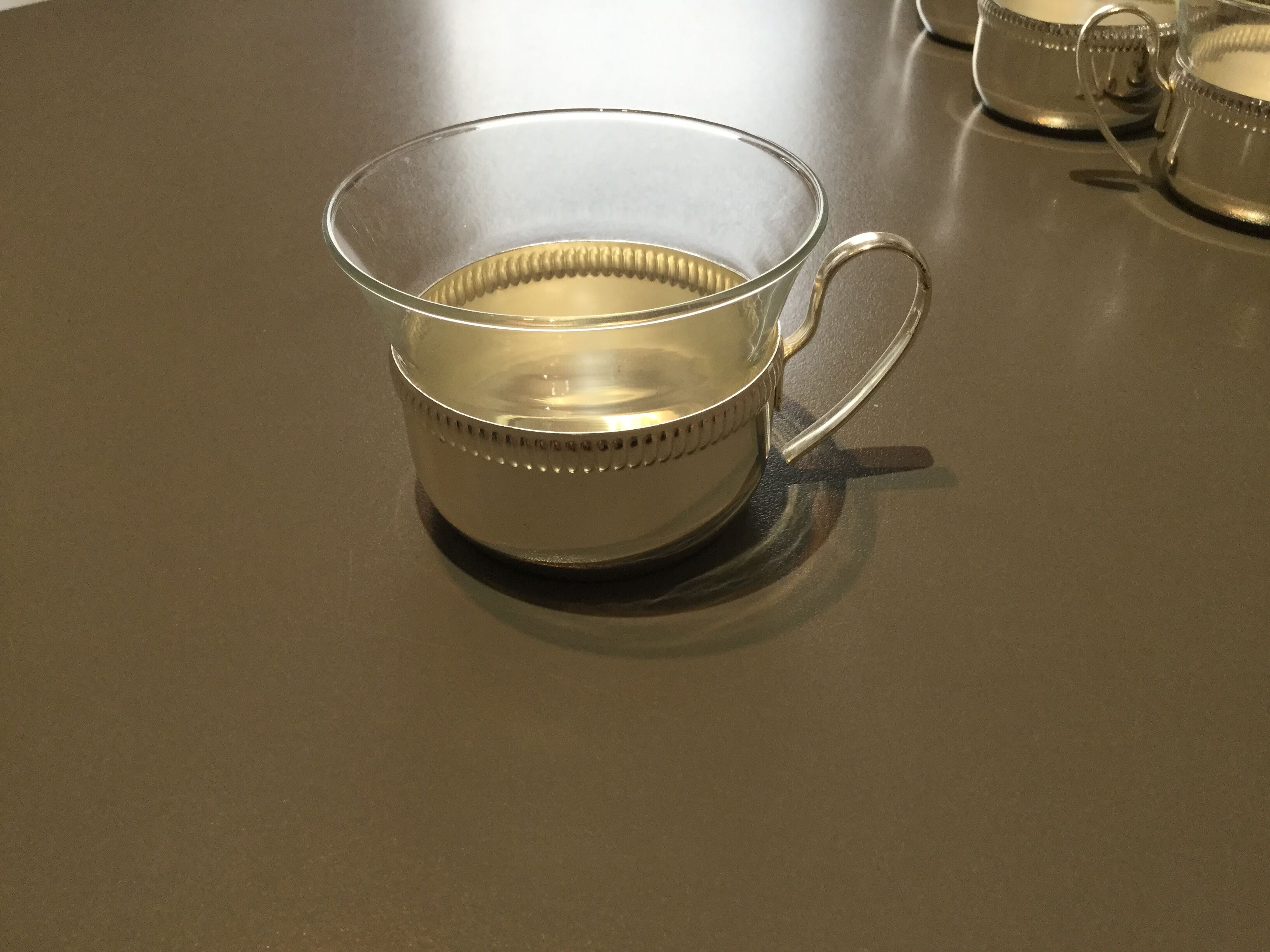 Glass and silver metal cups