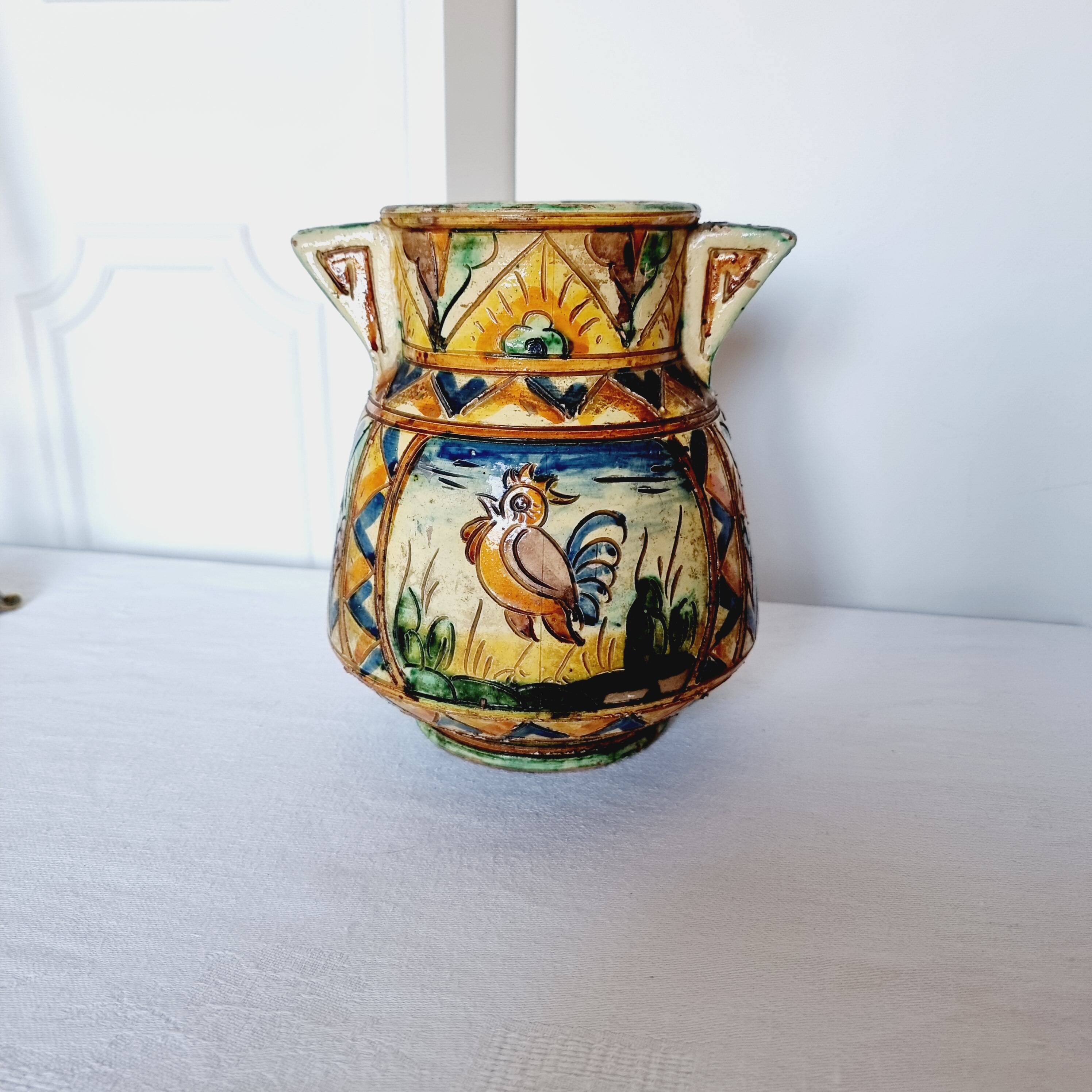 Antique majolica water pitcher made in Italy and hand painted.